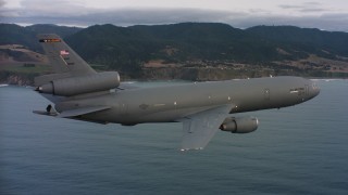WAAF03_C042_011881 - 4K stock footage aerial video of a McDonnell Douglas KC-10 in flight near the Northern California coast