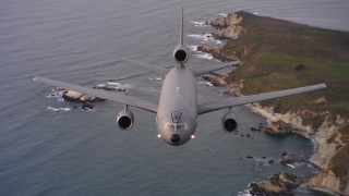 WAAF03_C053_01188P - 4K stock footage aerial video of a reverse view of a McDonnell Douglas KC-10 flying by the coast of Northern California