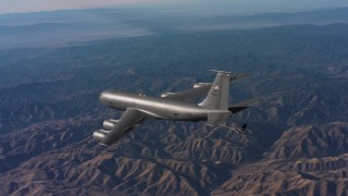 WAAF04_C019_0118SM - 4K stock footage aerial video of revealing a Boeing KC-135 flying over mountains in Northern California