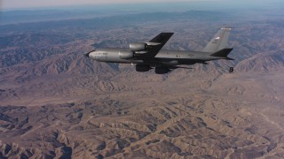 WAAF04_C027_0118PJ - 4K stock footage aerial video of a Boeing KC-135 flying over mountains in Northern California
