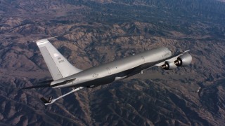 WAAF04_C038_01186H - 4K stock footage aerial video of a Boeing KC-135 lowering refueling boom above Northern California