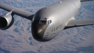 WAAF04_C043_0118NU - 4K stock footage aerial video of the nose and cockpit of a Boeing KC-135 in flight over Northern California