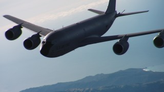 WAAF04_C050_011898 - 4K stock footage aerial video of a Boeing KC-135 flying near the coast of Northern California