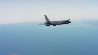 WAAF04_C058_01181M - 4K stock footage aerial video of a Boeing KC-135 flying over the ocean in Northern California