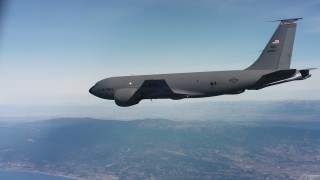 WAAF04_C062_0118SH - 4K stock footage aerial video of a Boeing KC-135 flying near the coast in Northern California