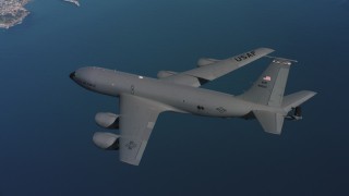 WAAF04_C065_0118AU - 4K stock footage aerial video of a Boeing KC-135 over the Pacific Ocean near the Northern California coast
