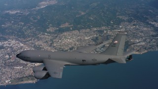 WAAF04_C065_0118AU_S000 - 4K stock footage aerial video of a Boeing KC-135 over the ocean near the coast of Northern California