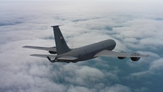 WAAF04_C070_0118HE - 4K stock footage aerial video of a Boeing KC-135 above clouds over the Pacific Ocean in Northern California