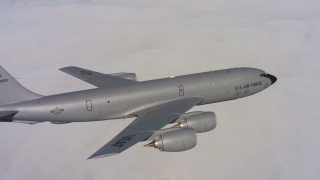 WAAF04_C081_01189U - 4K stock footage aerial video of tracking a Boeing KC-135 flying over low clouds in Northern California