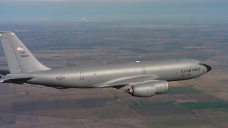 WAAF04_C091_0118T6 - 4K stock footage aerial video of a Boeing KC-135 over farmland in Northern California