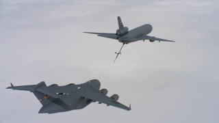 WAAF07_C033_0119VP - 4K stock footage aerial video of a McDonnell Douglas KC-10 refueling a Boeing C-17 over Northern California