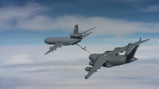 WAAF07_C040_0119WE_S000 - 4K stock footage aerial video of a McDonnell Douglas KC-10 finished refueling a Boeing C-17 in Norther California