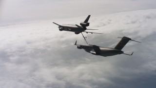 WAAF07_C042_0119DR - 4K stock footage aerial video of a view of a McDonnell Douglas KC-10 refueling a Boeing C-17 over Northern California