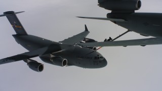 WAAF07_C049_0119K9 - 4K aerial stock footage video a McDonnell Douglas KC-10 fueling a Boeing C-17 over Northern California