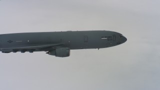 WAAF07_C055_01197X - 4K stock footage aerial video pan across a McDonnell Douglas KC-10 to reveal a Boeing C-17 over Northern California