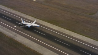 WAAF08_C002_01193P - 4K stock footage aerial video of a Boeing C-32 lifting off from Travis Air Force Base, California