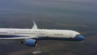 WAAF08_C025_0119Q7 - 4K stock footage aerial video of a Boeing C-32 in flight over farm fields of Northern California 